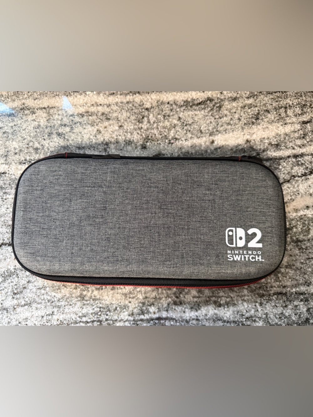 Nintendo Switch 2 Gray Carry Case with Red Zipper Accent